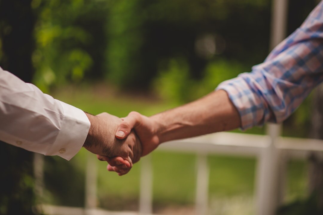 Business handshake partnership agreement